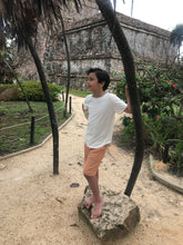 Load image into Gallery viewer, Boy in Tulum, Mexico wearing Fauna hemp and organic cotton shorts and hemp and organic cotton shirt.
