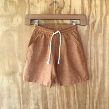 Load image into Gallery viewer, FAUNA Kids Rust Orange Sustainable Hemp Shorts featuring 2 front pockets, a comfortable crotch inset, a waistband with organic cotton rope to adjust to child's waist size, and lots of love to Mother Earth.