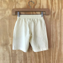 Load image into Gallery viewer, FAUNA Kids Beige Sustainable Hemp Shorts featuring 2 front pockets, a comfortable crotch inset, a waistband with organic cotton rope to adjust to child's waist size, and lots of love to Mother Earth. 
