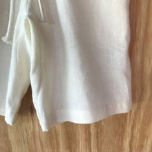 Load image into Gallery viewer, Close-up of FAUNA Kids Beige Sustainable Hemp Shorts featuring 2 front pockets, a comfortable crotch inset, a waistband with organic cotton rope to adjust to child's waist size, and lots of love to Mother Earth. 

