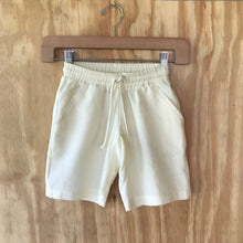 Load image into Gallery viewer, FAUNA Kids Beige Sustainable Hemp Shorts featuring 2 front pockets, a comfortable crotch inset, a waistband with organic cotton rope to adjust to child's waist size, and lots of love to Mother Earth. 

