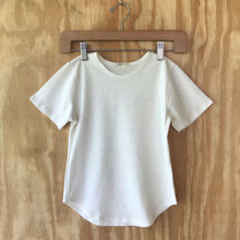 Load image into Gallery viewer, FAUNA Kids Off White Hemp tee featuring a curved hem, round neck, and lots of love to Mother Earth.
