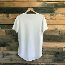 Load image into Gallery viewer, Back of FAUNA off-white hemp and organic cotton mens tee featuring a raw edged pocket, curved hem, and round neck. 
