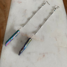 Load image into Gallery viewer, Fauna healing crystals as jewelry with these beautiful long shoulder duster earrings. Made from a stainless steel chain with a Rainbow Aura Quartz crystal at the end, connected to stainless steel french hook ear wires.
