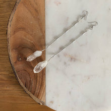 Load image into Gallery viewer, Fauna healing crystals as jewelry with these beautiful long shoulder duster earrings. Made from a stainless steel chain with a White Quartz crystal at the end, connected to stainless steel french hook ear wires.
