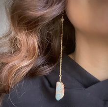 Load image into Gallery viewer, Woman wearing a Fauna eucalyptus and organic cotton hoodie and healing crystal jewelry long shoulder duster earrings made from an 18K gold plated chain with a Snakeskin Jasper crystal at the end, Snakeskin Jasper mini crystal at the top, and connected to 18K gold plated stainless steel french hook ear wires.
